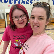 girl wearing pink shirt and hat