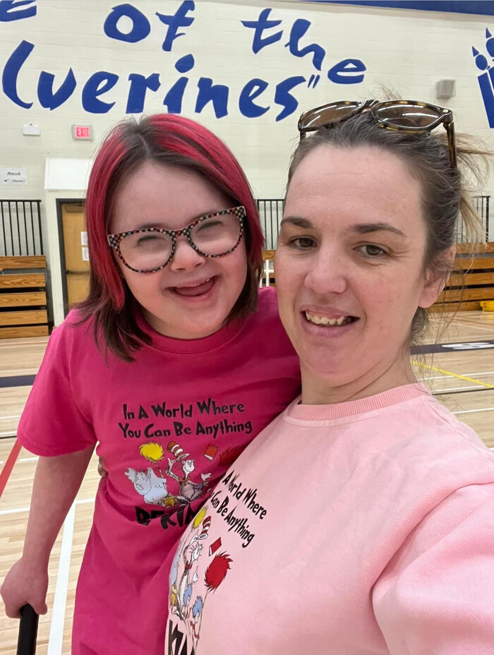 girl wearing pink shirt and hat