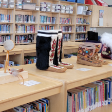 Indigenous hand drum and moccasins in school library